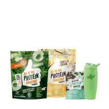 The Shop FlavCity Lucky Blend Shamrock Smoothie Bundle, featuring Shamrock, Vanilla Cream, and Chocolate protein smoothie powders plus a limited edition Shamrock Shaker bottle, is displayed against a plain white background.