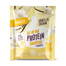 Front panel of FlavCity Vanilla Cream All-in-One Protein Smoothie powder single-serving packet. Package features modern typography highlighting ‘25g Protein’ and ‘10g Collagen’ on a cream-yellow background with dynamic milk splashes and vanilla beans. Product is labeled as non-GMO, gluten-free, and displays the Bobby Approved seal. Design includes floating vanilla ice cream scoops and vanilla pods for visual appeal.