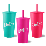 Three Shop FlavCity Straw Tumblers in teal, magenta, and pink are shown with bold white FLAVCITY lettering. Each double-walled stainless steel tumbler with a straw sits on a light gray background.