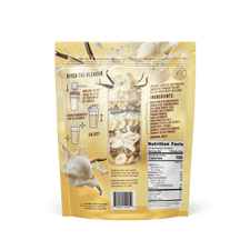 The back of the Shop FlavCity Vanilla Cream Protein Smoothie pouch shows mixing instructions, nutrition facts, a grass-fed whey and collagen ingredient list, vanilla flowers, milk splashes, a powder scoop, and has a yellow and cream design.