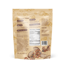 Back of a beige Shop FlavCity snack package with floral and nut designs. Centered is the Nutrition Facts label for the Plant-Based Chocolate Peanut Butter Protein Smoothie, plus ingredients, nutrition info, directions, and company details.