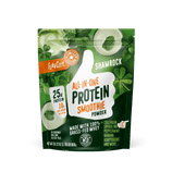 A green and white pouch of Shop FlavCity Shamrock Protein Smoothie features a big thumbs-up, clover leaves, and highlights like 25g protein, collagen smoothie benefits, grass-fed whey, and spirulina.