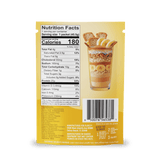 Back of a Shop FlavCity Protein Smoothie: Single-Serve Packets showing nutrition facts, ingredients, barcode, and an image of layered yogurt with granola, nuts, banana slices & biscuit sticks—plus serving size, calories & manufacturer info.
