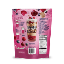 A pink pouch of Shop FlavCity Cherry Berry Protein Smoothie features a smoothie layered with fruit and granola on the front. The back displays instructions, ingredients, nutrition facts, berries, cherries, and highlights grass-fed whey.