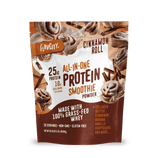 A stand-up pouch of Shop FlavCity Cinnamon Roll Protein Smoothie features cinnamon roll images and highlights 25g protein, 10g collagen, grass-fed whey, plus natural banana and vanilla flavors for a high-protein smoothie.