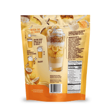 A yellow and orange Shop FlavCity Pineapple Coconut Protein Smoothie mix package displays a layered smoothie, preparation instructions, nutrition facts, ingredients, and images of bananas, pineapple, and coconut pieces on the back.