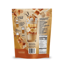Back of a Shop FlavCity Salted Caramel Protein Smoothie pack features a caramel banana shake illustration, prep instructions, nutrition facts, ingredients list, and images of caramel pieces, banana slices, and a grass-fed whey milkshake.
