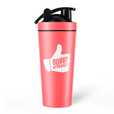 Coral-colored shaker bottle with a black lid, displaying a white thumbs-up icon and the words ‘Bobby Approved’ on the front, set against a white background