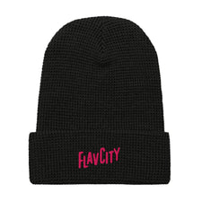 The Shop FlavCity Waffle Beanie - Pink Logo features a black waffle-knit design and bold pink "FlavCity" embroidery on the folded brim—ideal for outdoor adventures.
